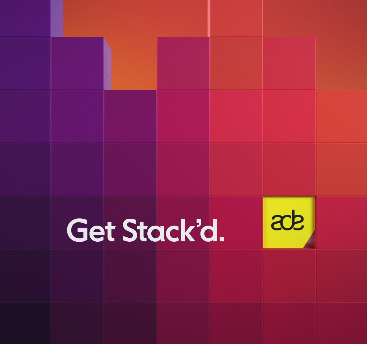 Get Stack'd. A wall of purple-to-red blocks with one yellow ADE block pushed out of it.